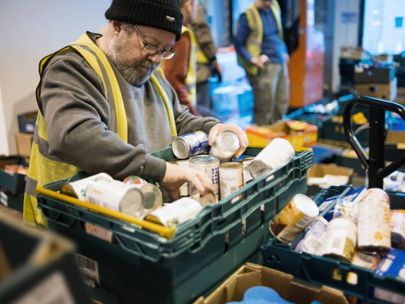 A volunteer for FareShare Northern Ireland sorts through food rescued from going to waste - it will then be redistributed to charities across the country